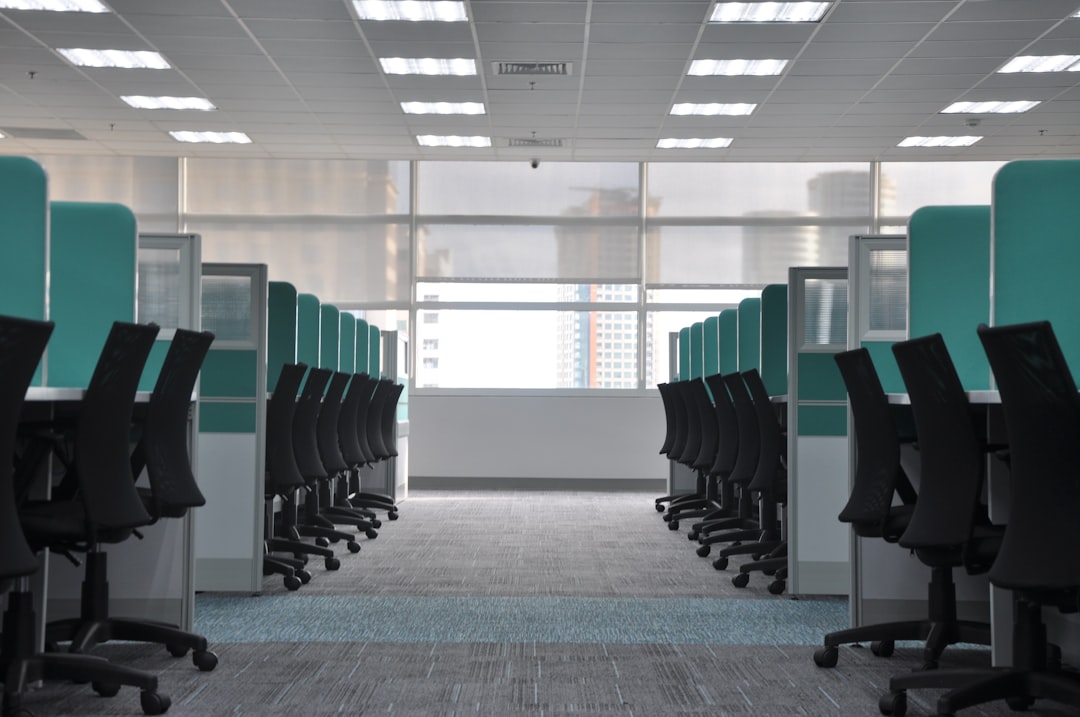get-in-touch empty-black-rolling-chairs-at-cubicles-2zzp12chxhu